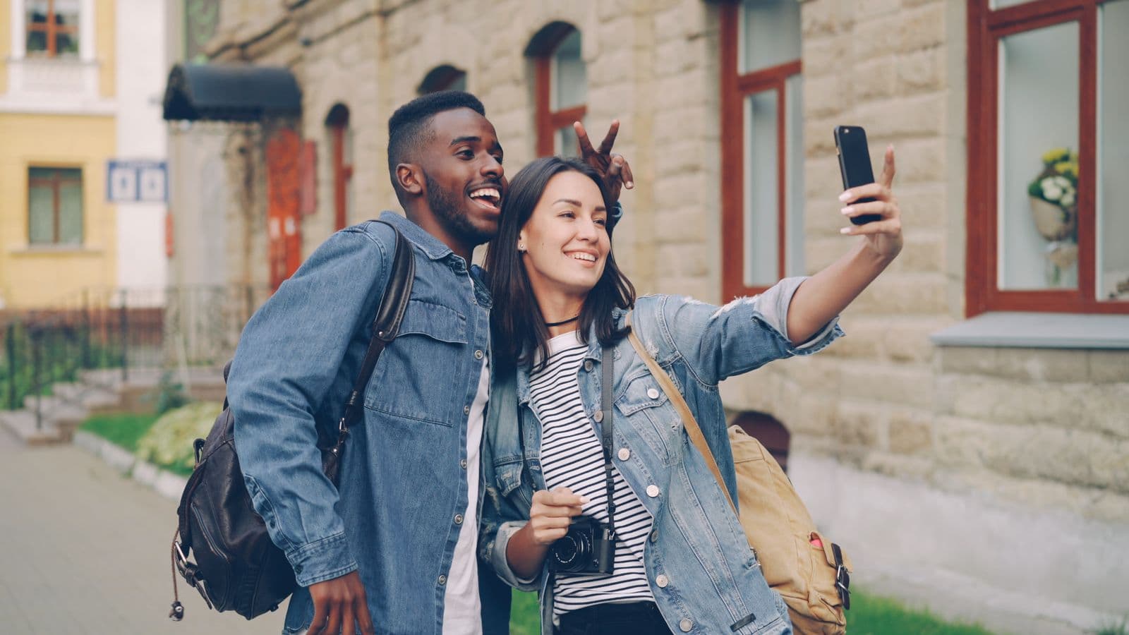 Young friends documenting an everyday moment in an American city